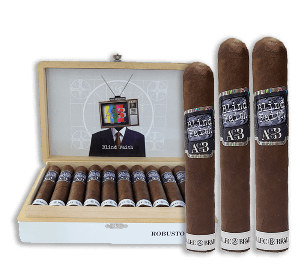 Three Alec Bradley Blind Faith cigars displayed in front of an open box filled with cigars.