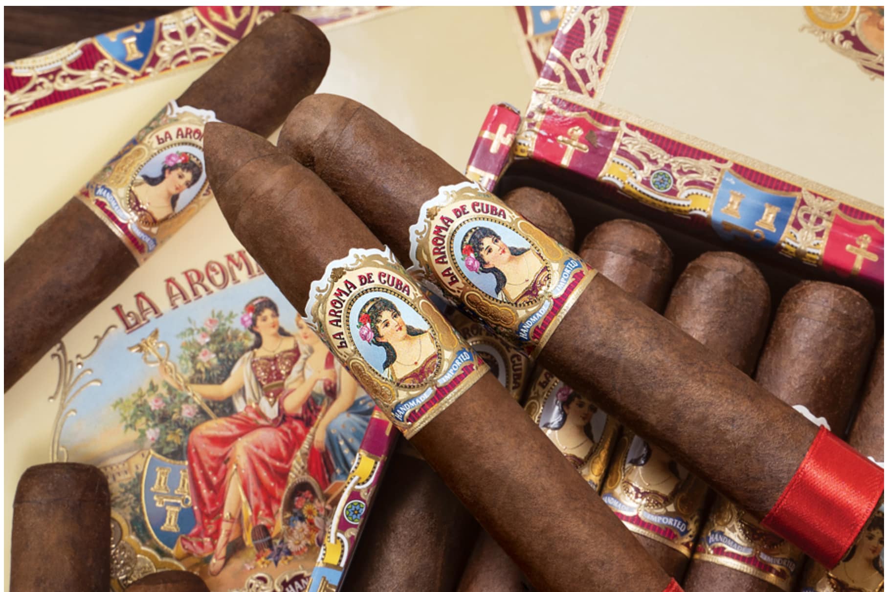 Box of La Aroma de Cuba Original cigars arranged neatly with vintage-style bands and rich brown wrappers.