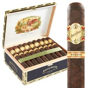 Brick House Maduro cigar with a dark, oily wrapper resting on a wooden surface