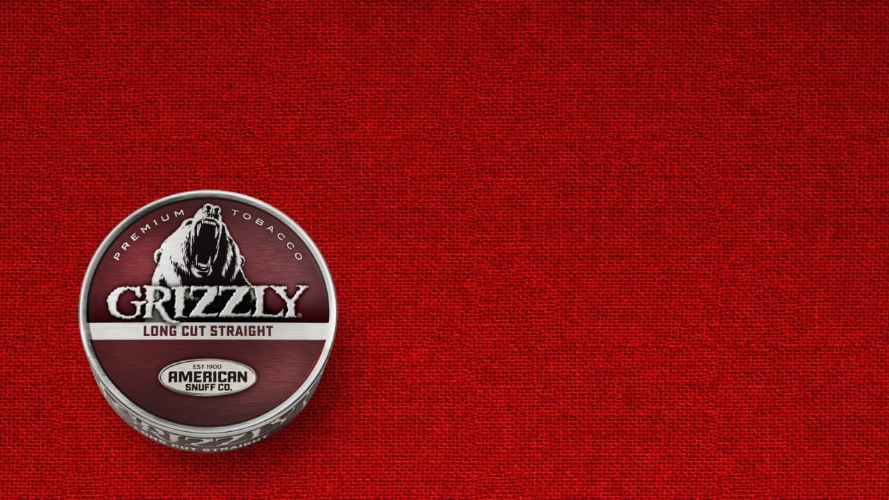 A can of Grizzly Long Cut Straight smokeless tobacco with its signature red label and bear logo.