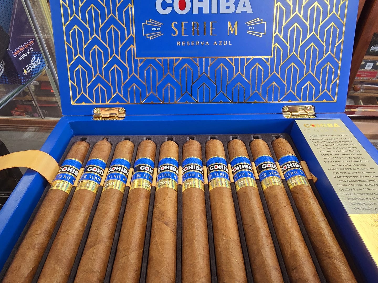 Open box of Cohiba Serie M Reserva Azul premium cigars with rich blue accents