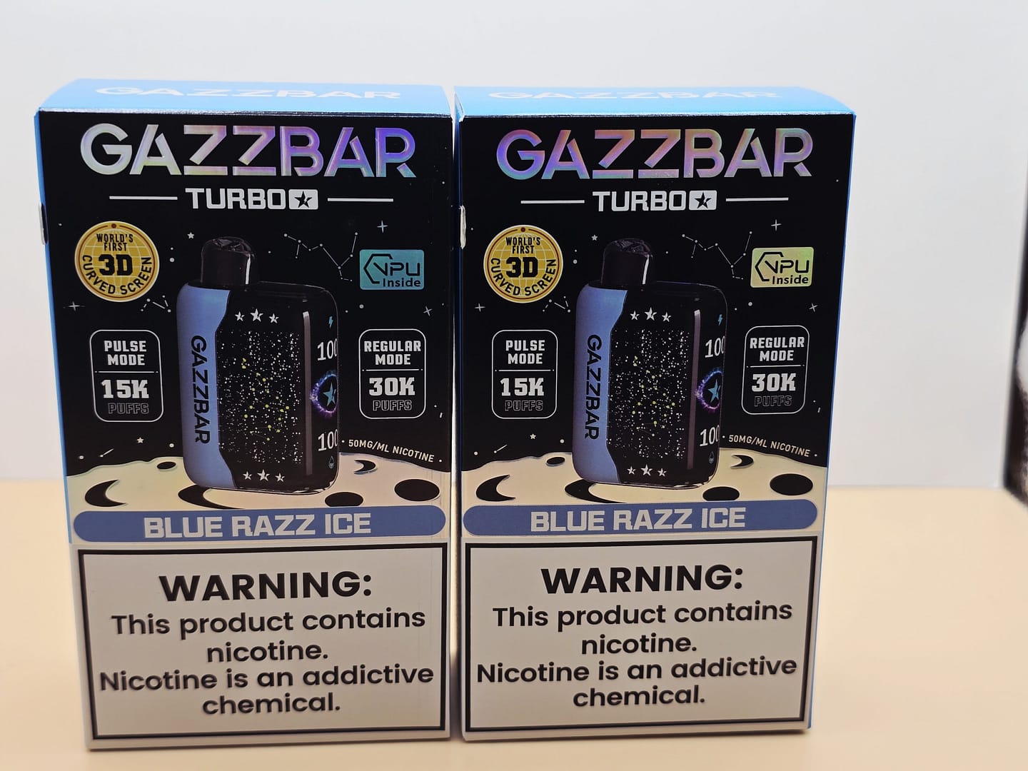 2 Pack Gazzbar Disposable Vape Blue Razz Ice flavor with 30,000 puffs, 28ml e-liquid, dual mesh coil, and 3D curved screen.