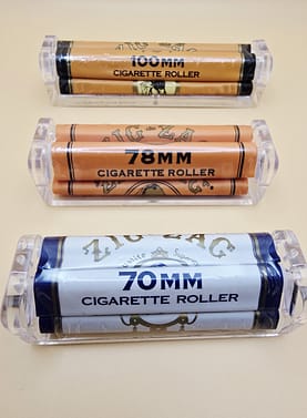 Three different sizes of Zig Zag Rolling Machines: Small, Medium, and King Size, with their corresponding packaging.