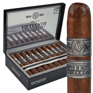 Open box of Rocky Patel Fifteenth Anniversary cigars with dark, box-pressed wrappers and silver-accented bands.