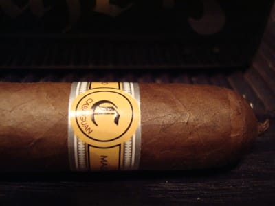 Single Cabaiguan cigar with smooth, light brown Ecuadorian Connecticut wrapper and elegant band.