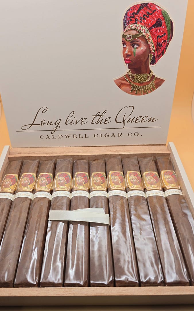 Open full box of Long Live The Queen Natural by Caldwell cigars showing neatly arranged cigars inside.