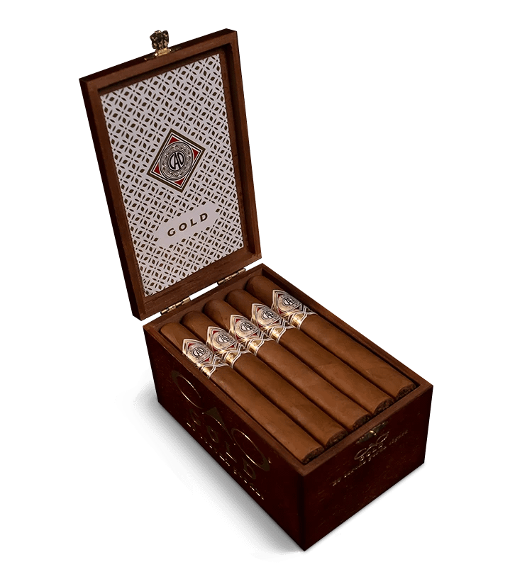 Open box of CAO Gold cigars with light Ecuadorian Connecticut wrappers and elegant presentation.