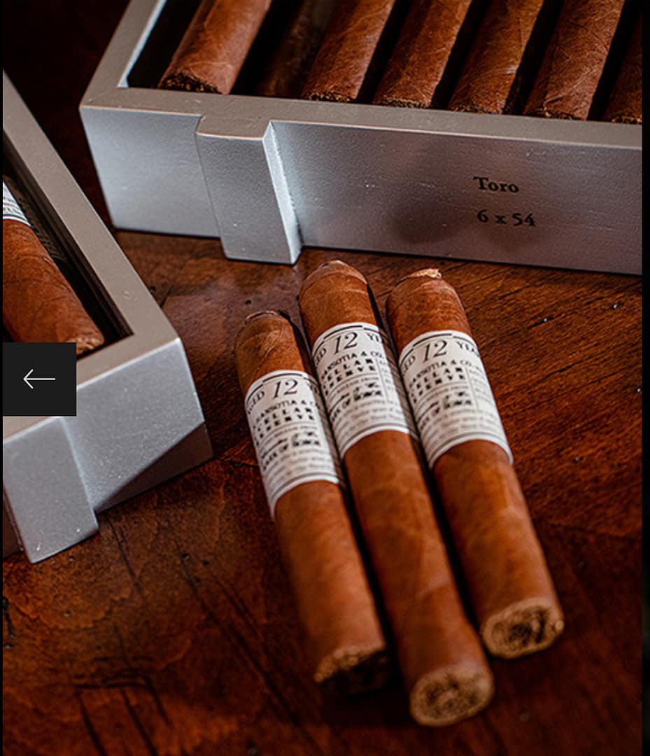 Three Gurkha Cellar Reserve Platinum 12 Year cigars laying on wooden surface