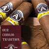 Open box of Aladino Corojo cigars with smooth, golden-brown wrappers and classic red-and-gold bands