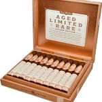 Open box of Rocky Patel A.L.R. Second Edition cigars, showcasing beautifully arranged cigars with rich packaging.