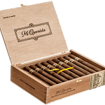 Open box of Mi Querida cigars with dark, earthy wrappers and bold banding