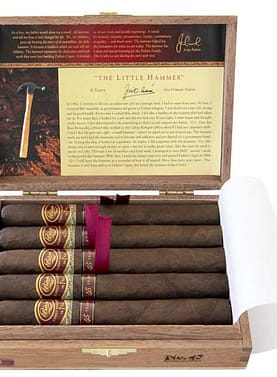 Open box of Padrón Family Reserve Natural cigars with smooth, light brown wrappers and numbered bands