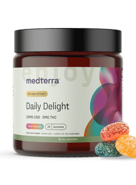 Jar of Medterra Daily Delight CBD Gummies with three gummies placed beside it to show size, shape, and texture.
