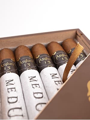 Asylum 13 Medulla Oblongata cigar with a dark, rich wrapper and distinctive band