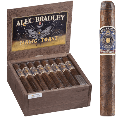 Single Alec Bradley Magic Toast cigar with light brown Connecticut Shade wrapper in front of an open box showing multiple cigars.