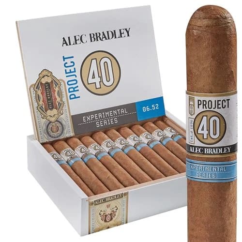Single The Project 40 cigar with medium brown wrapper, positioned in front of an open box displaying multiple cigars.