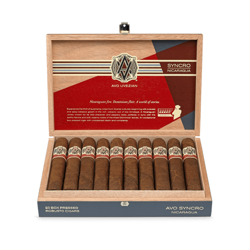 Open box of AVO Synchro Nicaragua cigars displaying rich brown wrappers and vibrant cigar bands.