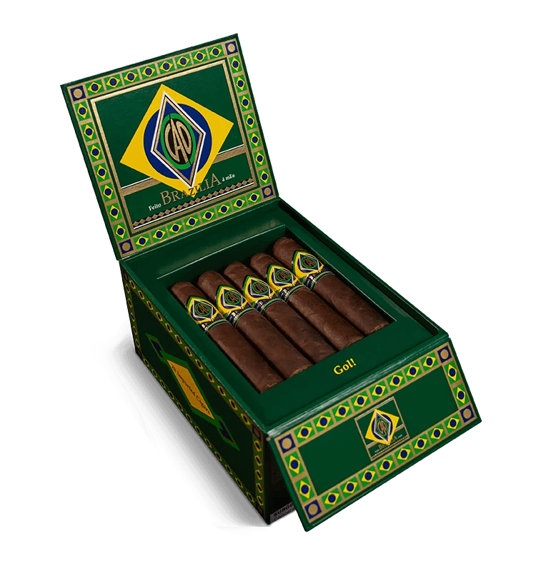 Open box of CAO Brazilia cigars with dark, oily Brazilian Maduro wrappers and bold branding.