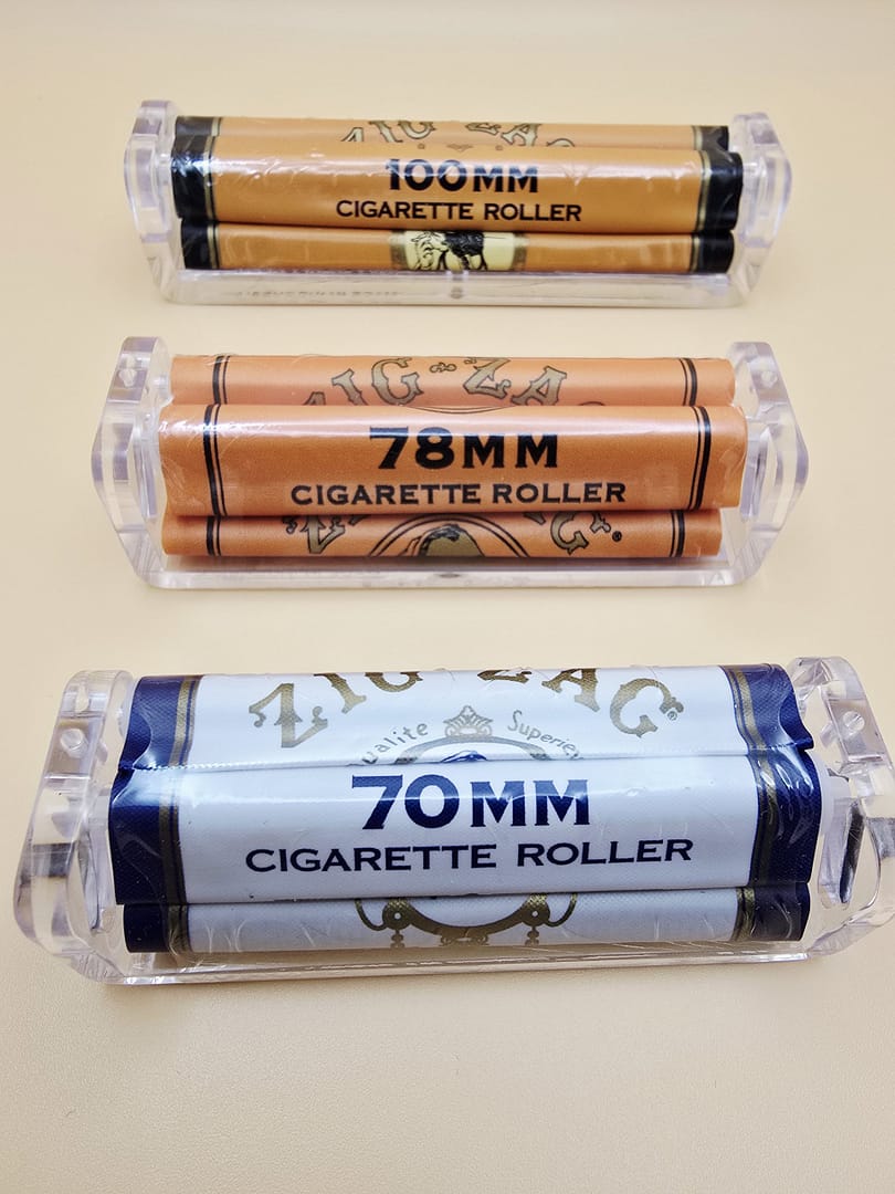 Three different sizes of Zig Zag Rolling Machines: Small, Medium, and King Size, with their corresponding packaging.