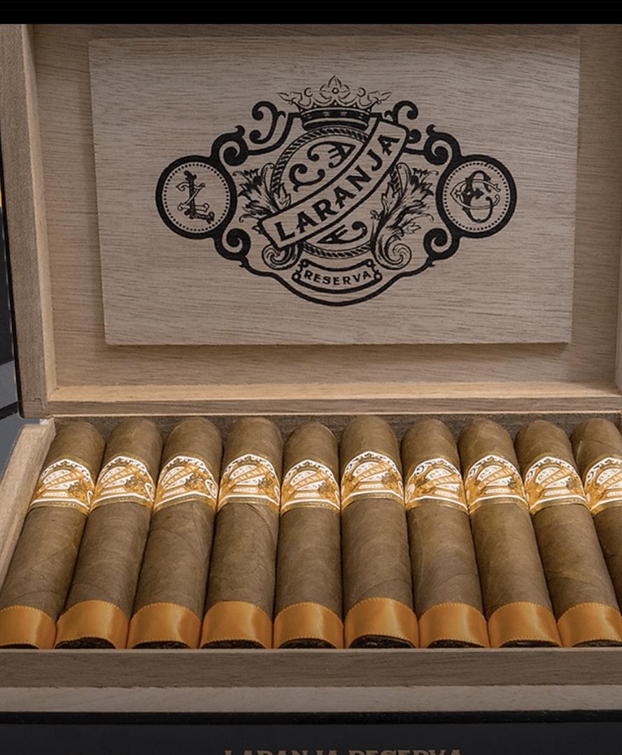 Open box of Laranja Reserva cigars with a beautiful Brazilian Laranja wrapper, neatly arranged, showcasing the elegant packaging and premium construction