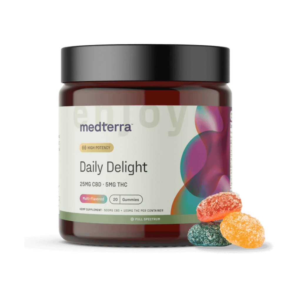 Jar of Medterra Daily Delight CBD Gummies with three gummies placed beside it to show size, shape, and texture.