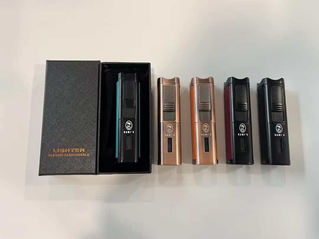 Four Rami's triple flame torch lighters with built-in cigar punch and poker tool in bronze with orange leather, bronze with brown leather, business black with crimson leather, and business black with light green leather