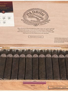 Open box of Padrón Maduro cigars with dark, oily wrappers and signature Padrón bands