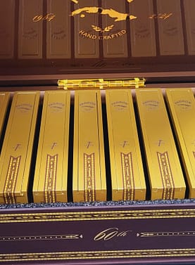 Open box of Padrón 1964 Anniversary 60th Maduro Limited Edition cigars with dark wrappers and signature bands