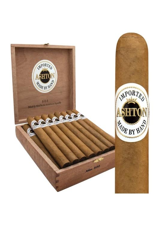 "An open box of Ashton Classic cigars showcasing neatly arranged, light golden cigars with white and gold bands, set in a cedar-lined wooden box."