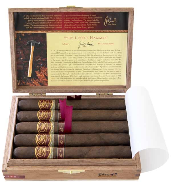 Open box of Padrón Family Reserve Natural cigars with smooth, light brown wrappers and numbered bands