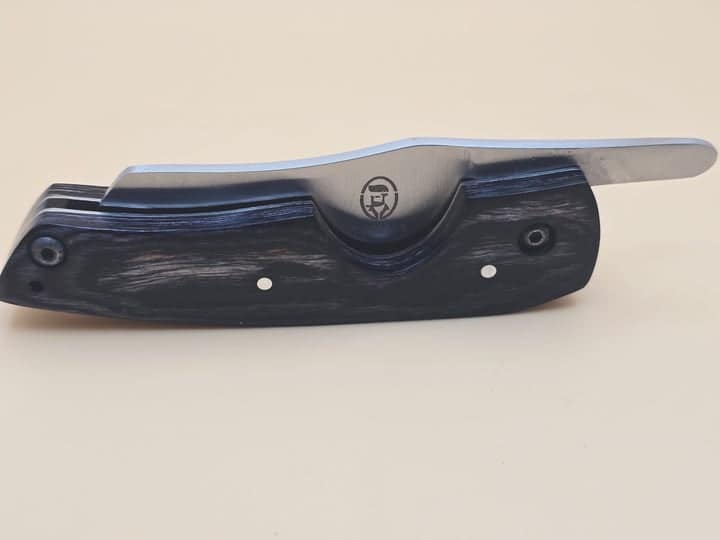 Rami's cigar knife with sleek black wood handle and stainless steel blade