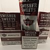Box of Swisher Sweets Perfecto Cigarillos with plastic tips, each sealed in individual foil pouches.