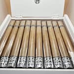 "Blackened M81 Shade cigars displayed in an open box, showcasing their smooth, creamy profile."