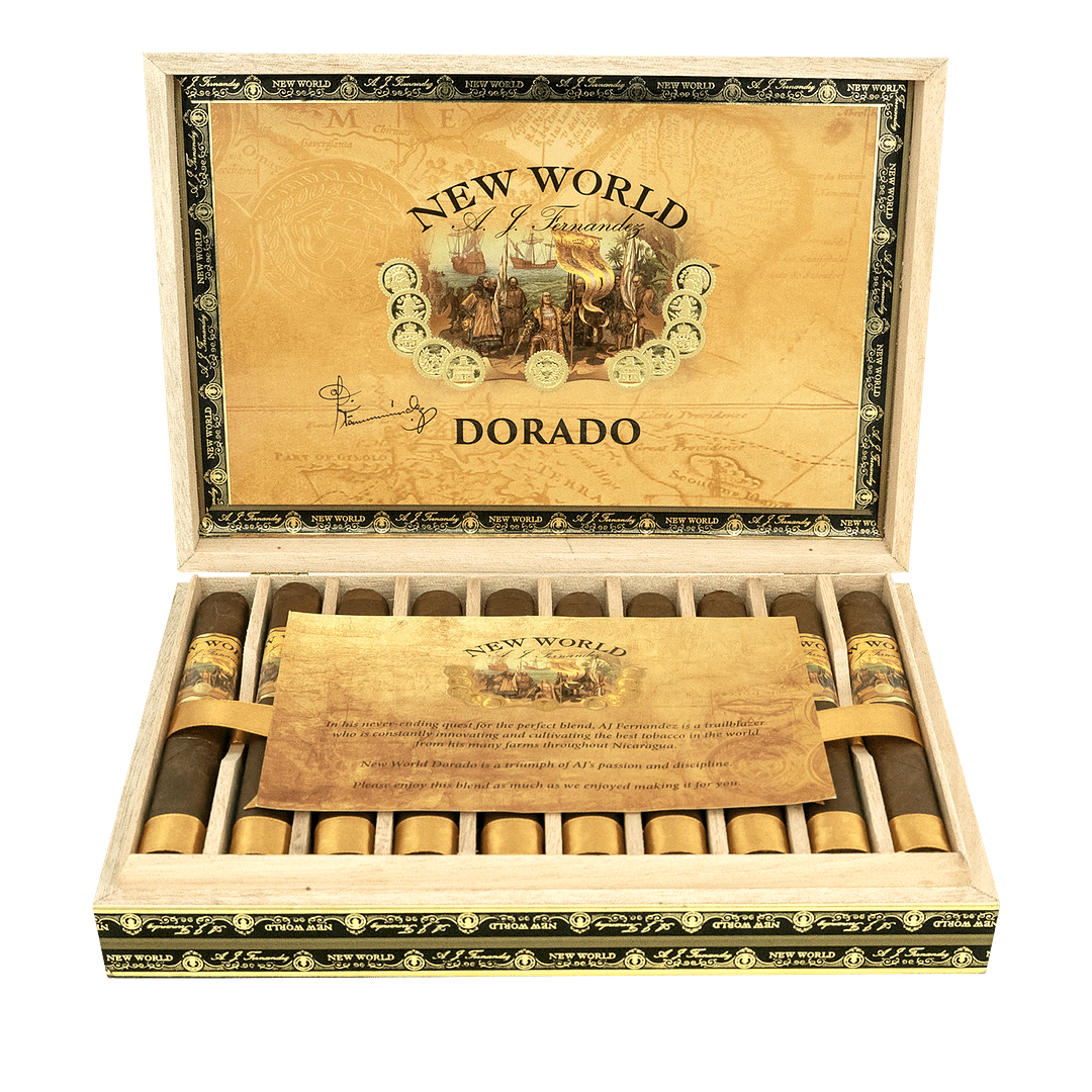 An open box of New World Dorado cigars, showcasing their golden Ecuadorian Sumatra wrappers and neatly arranged cigars, offering a medium to full-bodied smoke with creamy coffee, toasted almond, and subtle spice notes