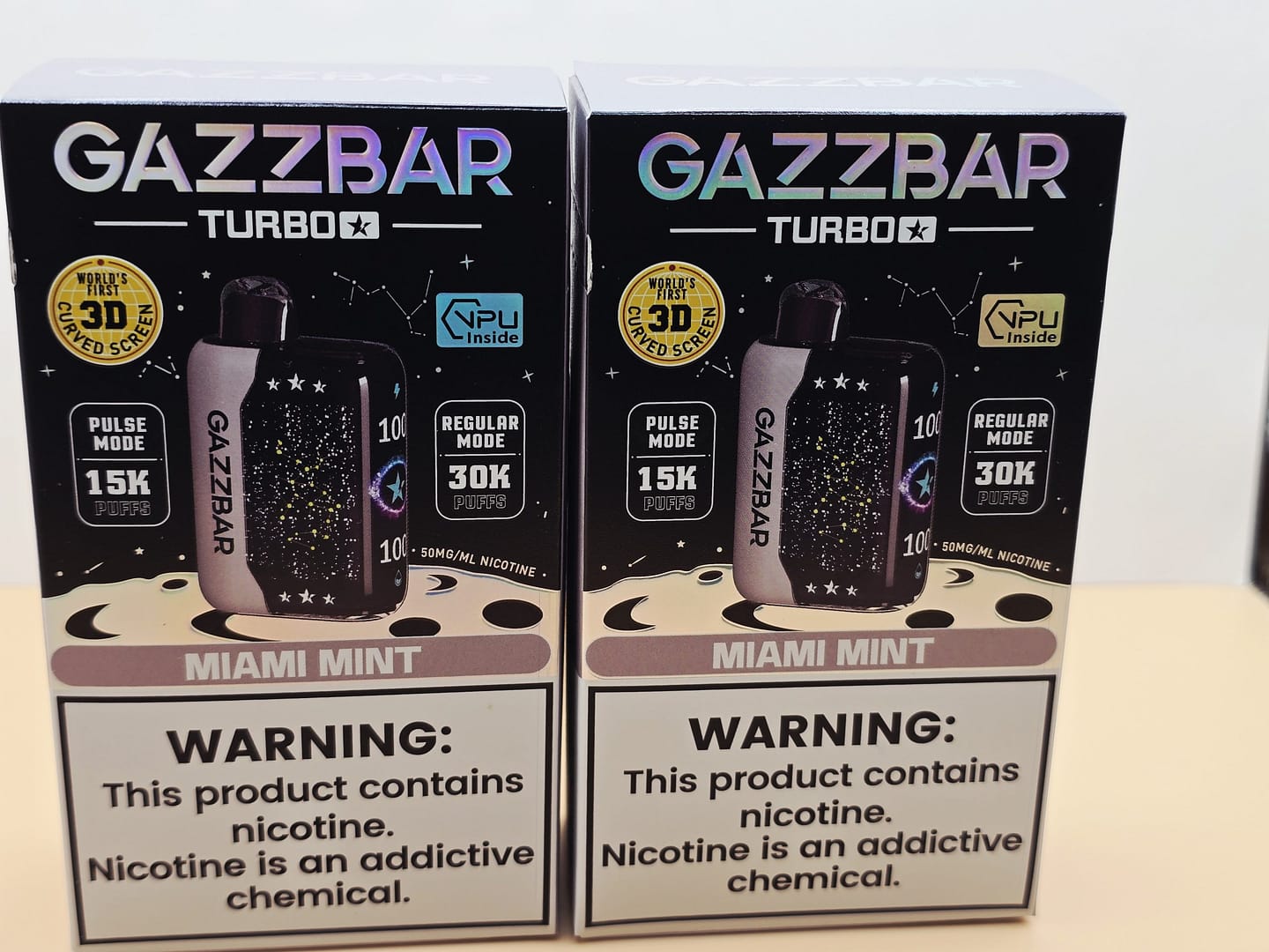 2 Pack Gazzbar Disposable Vape Miami Mint flavor with 30,000 puffs, 28ml e-liquid, dual mesh coil, 800mAh quick-charge battery, and 3D curved screen.