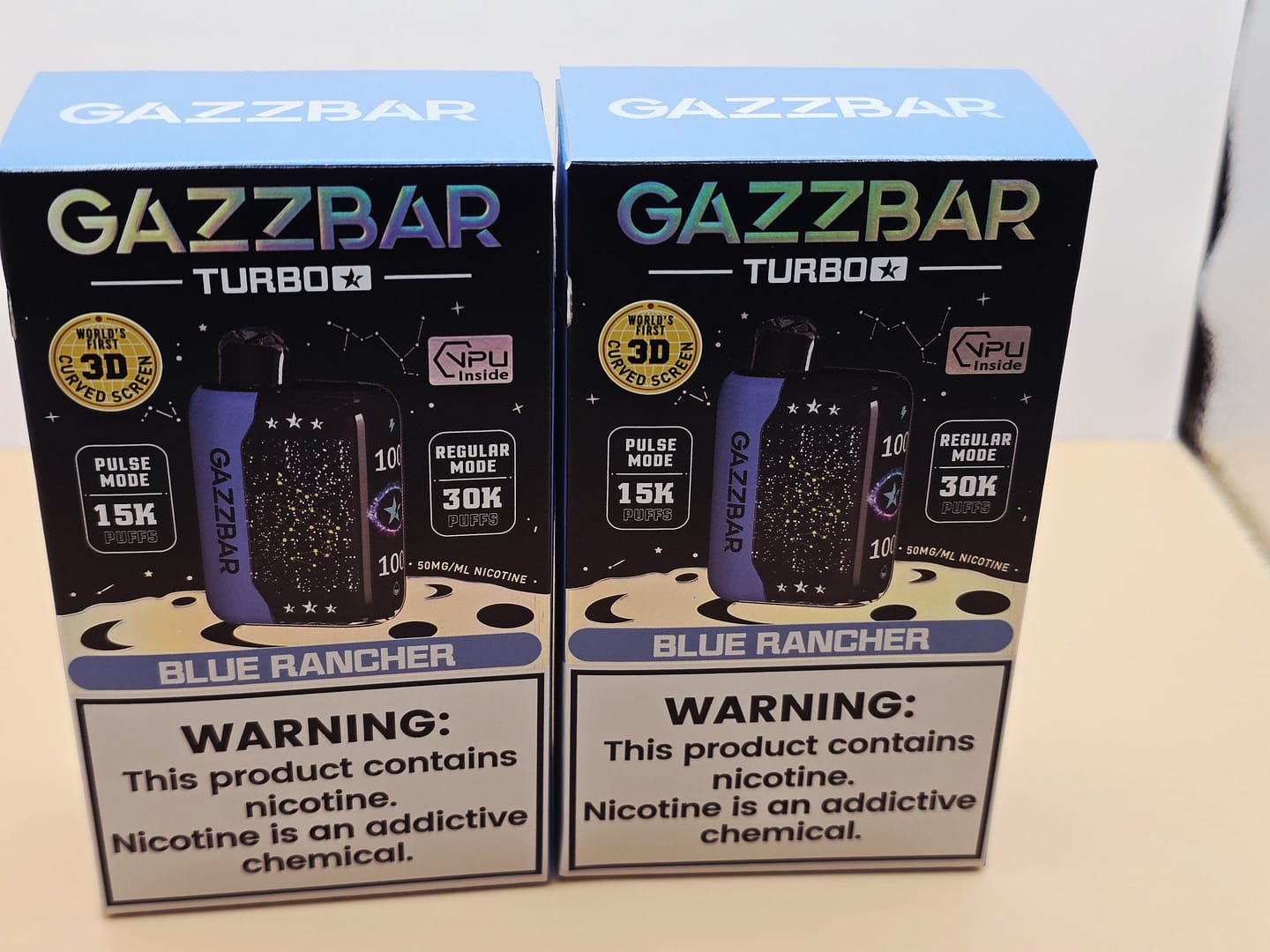 2 Pack Gazzbar Disposable Vape Blue Rancher flavor with 30,000 puffs, 28ml e-liquid, dual mesh coil, 800mAh quick-charge battery, and 3D curved screen.