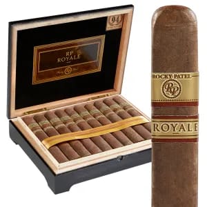 The Rocky Patel Royale is a luxurious, medium to full-bodied cigar that offers a richly complex and smooth smoking experience. Featuring an elegant Ecuadorian Sumatra wrapper over a dual binder of Connecticut Shade and Connecticut Broadleaf, and filled with aged Nicaraguan long-fillers, the Royale delivers a harmonious blend of flavors. Smokers can expect notes of espresso, sweet spice, almond, and leather, all balanced with a creamy finish. Consistently rated among the top cigars in the world, the Rocky Patel Royale is a true connoisseur's choice, ideal for those who appreciate depth, nuance, and impeccable construction.