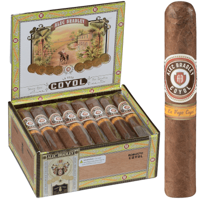 Single Alec Bradley Coyol cigar placed in front of an open box filled with cigars.