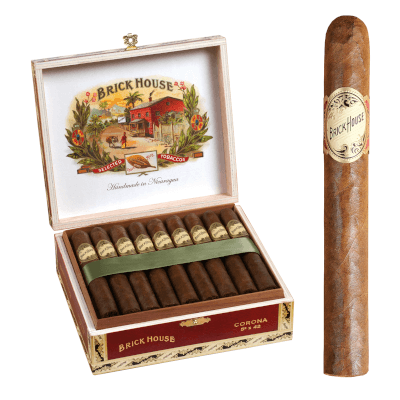 Brick House Classic cigar with natural sun-grown wrapper resting on a rustic wood background