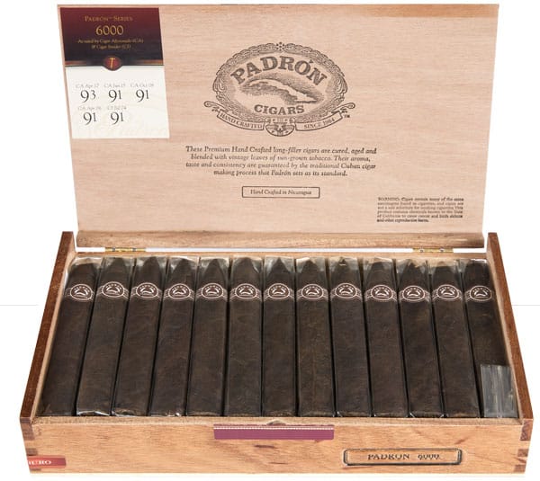 Open box of Padrón Maduro cigars with dark, oily wrappers and signature Padrón bands