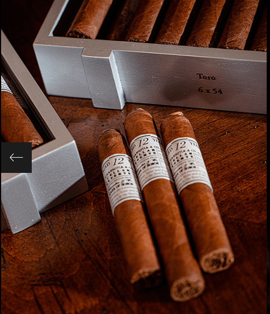 Three Gurkha Cellar Reserve Platinum 12 Year cigars laying on wooden surface