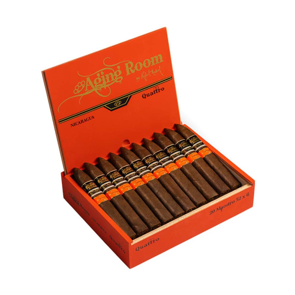 Aging Room Quattro Nicaragua cigar with dark wrapper and gold-accented band resting on wood