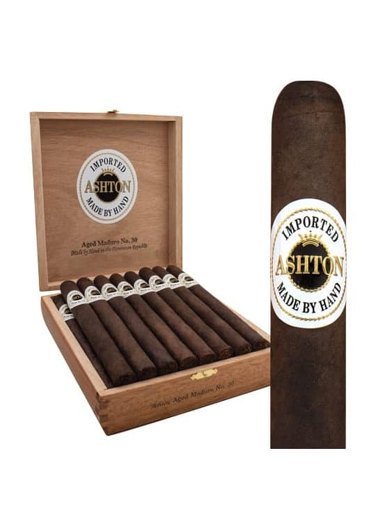 "Open box of Ashton Aged Maduro cigars showcasing dark, rich Connecticut Broadleaf-wrapped cigars with a deep brown hue, neatly arranged in a cedar-lined interior."